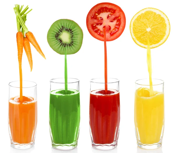 Juice pouring from fruits and vegetables into glass, isolated on white — Stock Photo, Image
