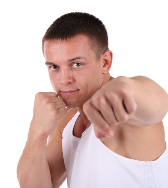 Yakışıklı genç kaslı sporcu yürütmek üzerinde beyaz izole egzersiz