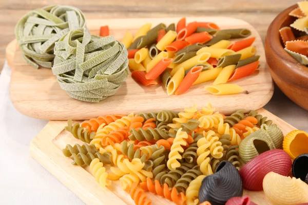 Colorful pasta on wooden background — Stock Photo, Image