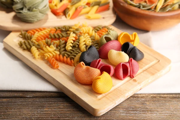 Colorful pasta on wooden background — Stock Photo, Image