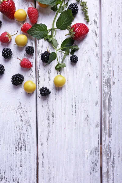 Different berries on wooden table close-up — Stock Photo, Image