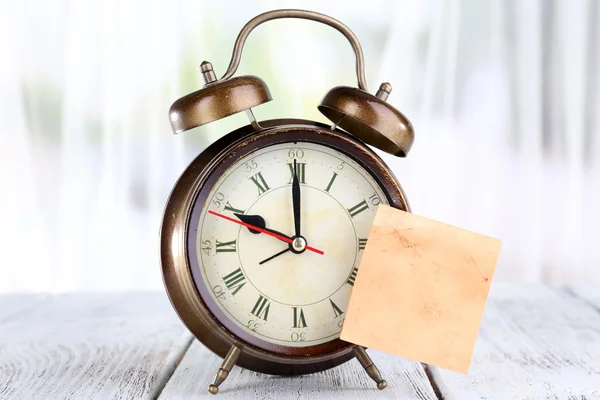 Alarm clock with sticker — Stock Photo, Image
