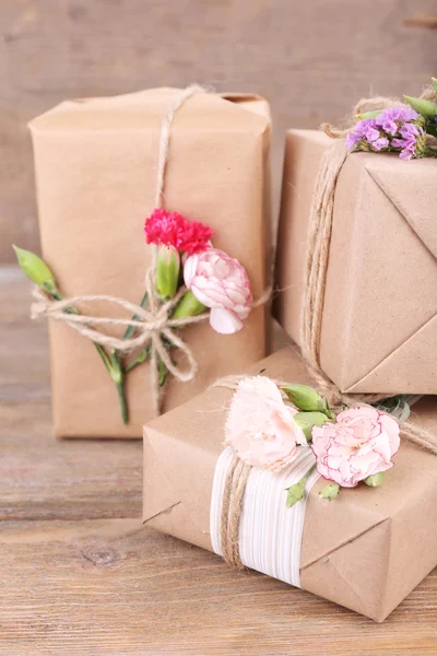 Beautiful gifts with flowers — Stock Photo, Image