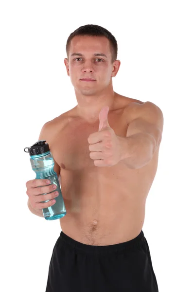 Schöner junger Sportler mit Flasche mit Wasser isoliert auf weiß — Stockfoto