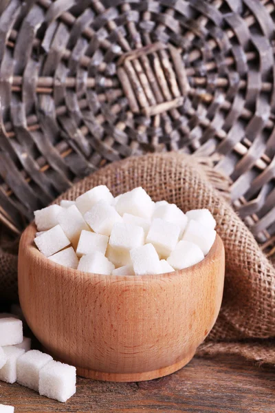 Refined sugar wooden bowl on table background — Stock Photo, Image