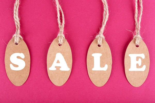 Sale tags on pink background — Stock Photo, Image