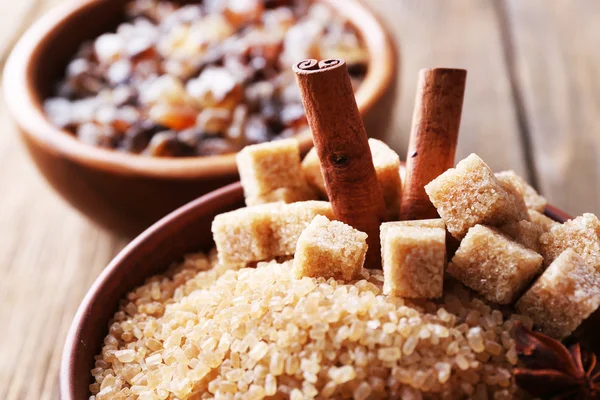 Brown sugar cubes and crystal sugar with spices — Stock Photo, Image