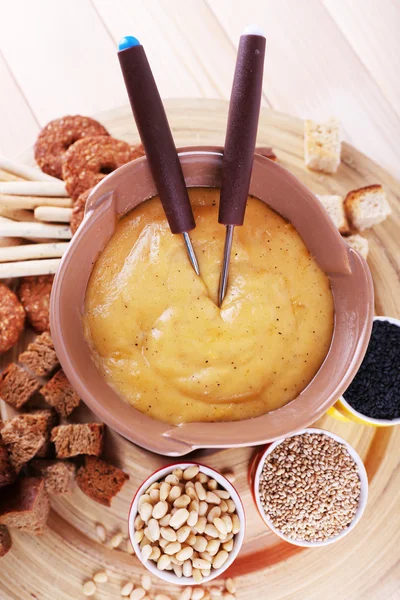 Fondue, biscuits, spices and rusks — Stock Photo, Image