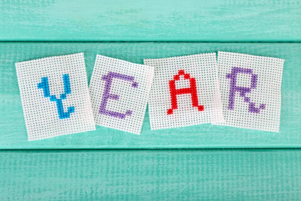 Word made embroidered letters — Stock Photo, Image