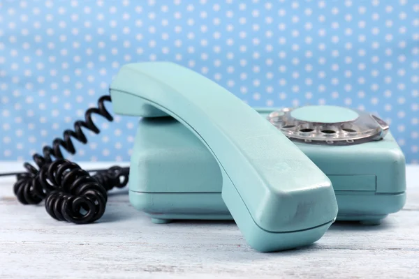 Retro turquoise telephone on wooden table — Stock Photo, Image