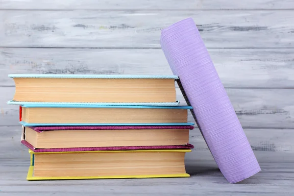 Color books on grey wooden background — Stock Photo, Image