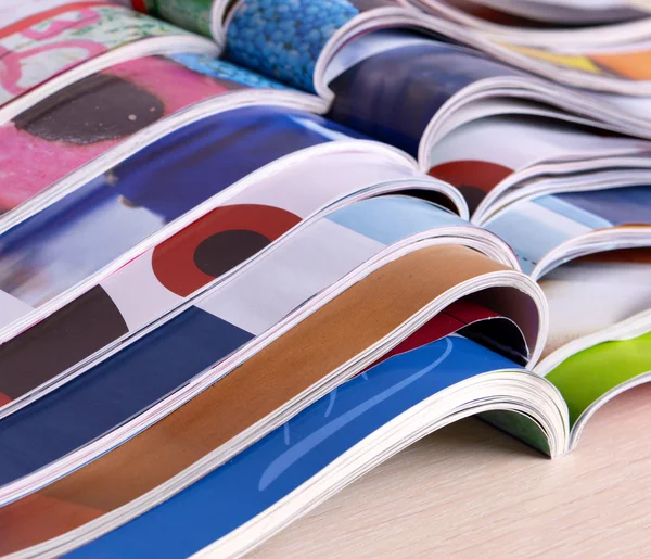 Magazines on wooden table close up — Stock Photo, Image