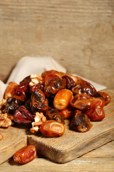 Tasty dates fruits on wooden table — Stock Photo, Image