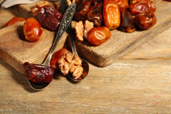 Tasty dates fruits on wooden table — Stock Photo, Image