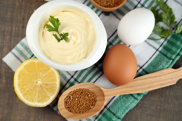 Mayonnaise ingredients on wooden background — Stock Photo, Image