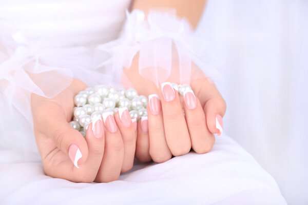 Wedding gloves on hands of bride