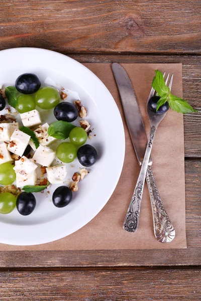 Tasty salad with grape and cheese — Stock Photo, Image