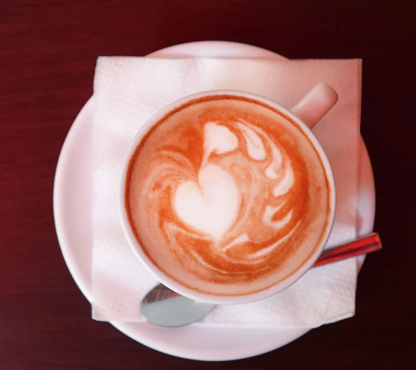 Copa de café con dibujo lindo en la cafetería — Foto de Stock