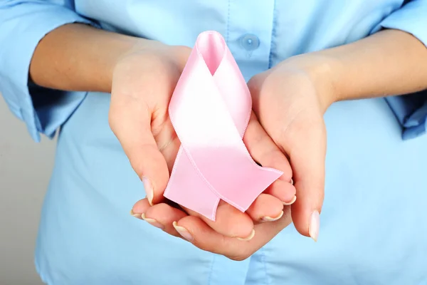 Woman holding ribbon — Stock Photo, Image