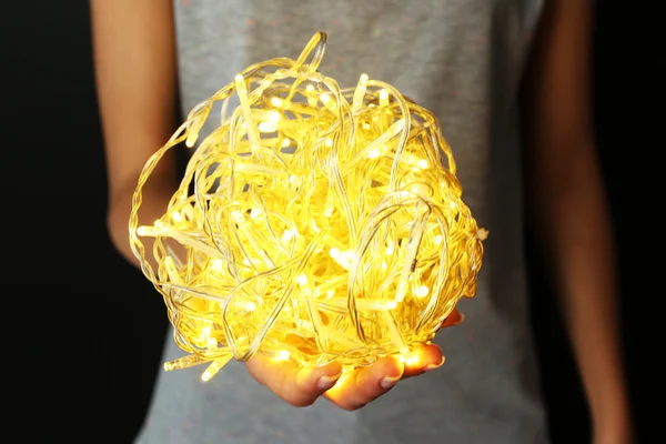 Woman holding garland — Stock Photo, Image