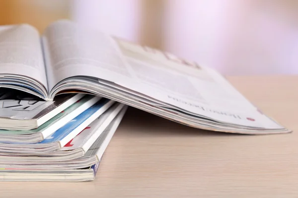 Magazines on wooden table — Stock Photo, Image