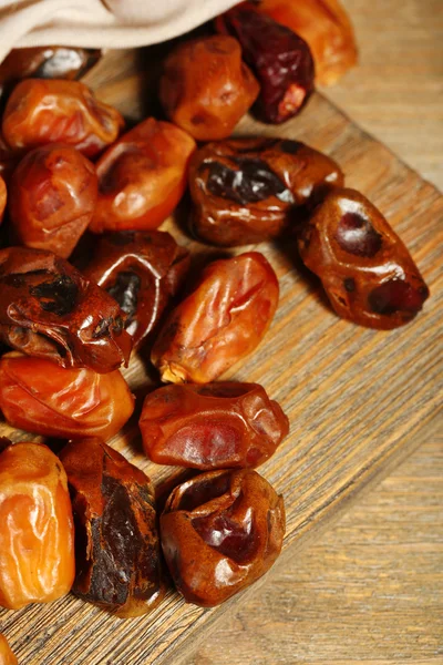 Tasty dates fruits on wooden table — Stock Photo, Image