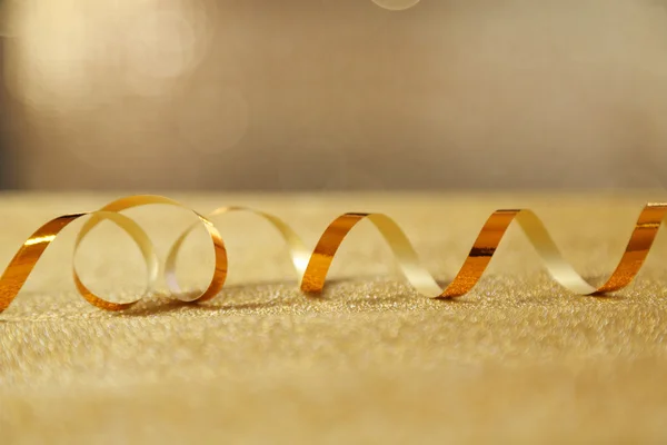 Serpentine ribbon on table — Stock Photo, Image