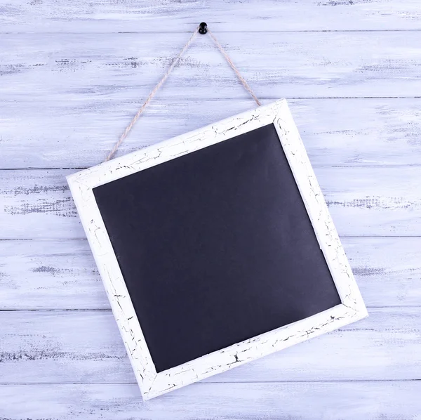 Retro  chalkboard on wooden background — Stock Photo, Image