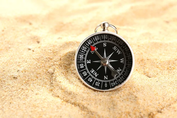Compass on sand close-up — Stock Photo, Image
