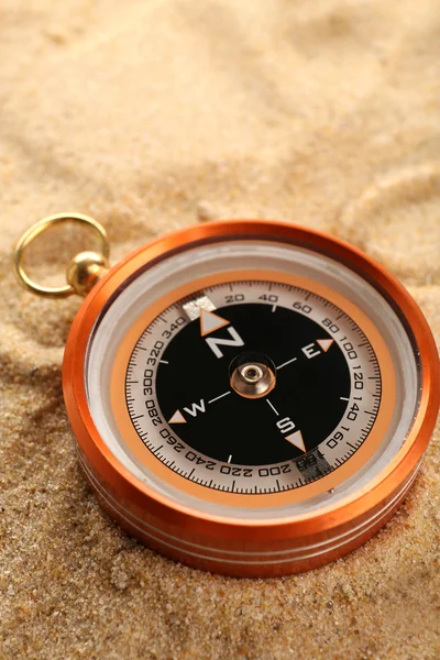 Compass on sand close-up — Stock Photo, Image