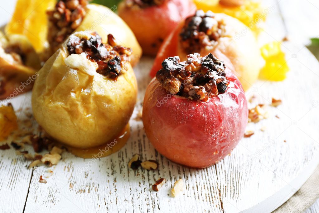 Baked apples on table close up