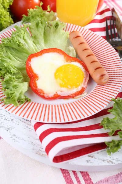 Scrambled egg with sausage and vegetables served on plate on fabric background — Stock Photo, Image