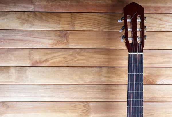 Fretboard guitarra em fundo de madeira — Fotografia de Stock