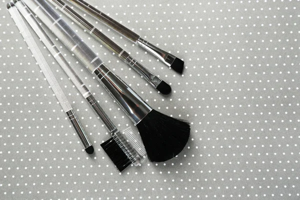 Brushes for makeup on grey background — Stock Photo, Image