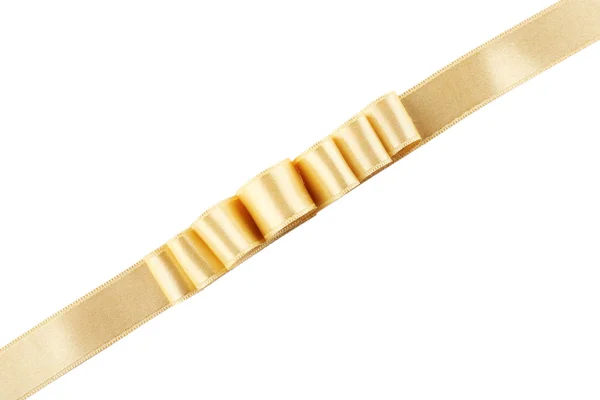 Fita dourada e arco isolado em branco — Fotografia de Stock