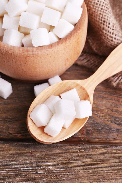 Refined sugar wooden bowl on table background — Stock Photo, Image