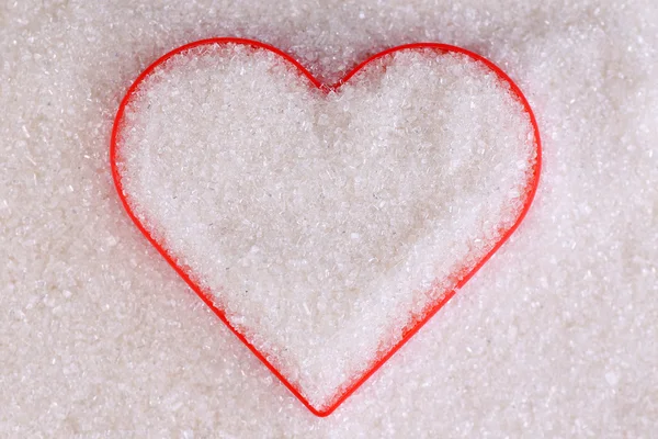 Heart covered in white sugar, close-up — Stock Photo, Image