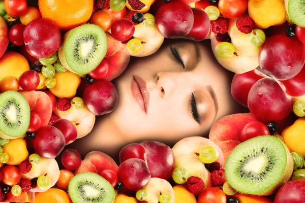 Woman beauty face with fruits frame, close-up — Stock Photo, Image