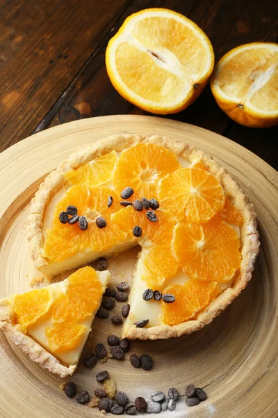 Homemade orange tart with coffee grains on wooden background — Stock Photo, Image