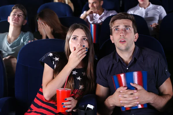 Young people watching movie in cinema — Stock Photo, Image