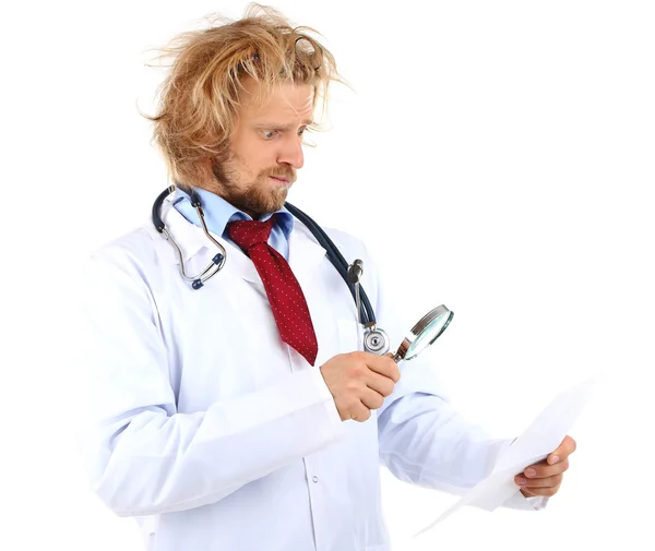 Funny doctor in glasses holding magnifier isolated on white — Stock Photo, Image