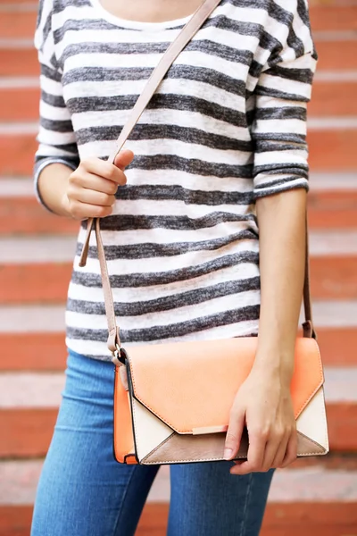 Girl with bag over his shoulder outdoors — Stock Photo, Image