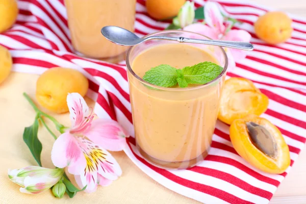 Apricot dessert in glasses on table close-up — Stock Photo, Image