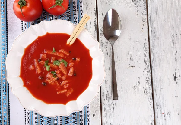 Tasty tomato soup with croutons on table close-up — Stock Photo, Image