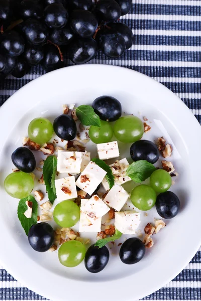 Tasty salad with grape and cheese, close up — Stock Photo, Image
