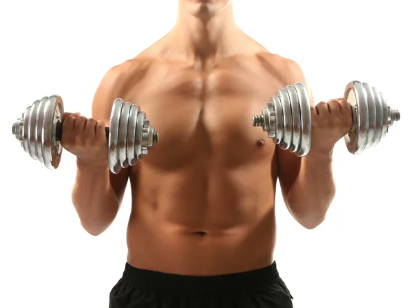 Bonito jovem desportista muscular executar exercício com halteres isolados em branco — Fotografia de Stock