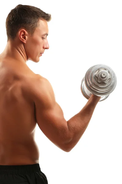 Handsome young muscular sportsman execute exercise with dumbbells isolated on white — Stock Photo, Image