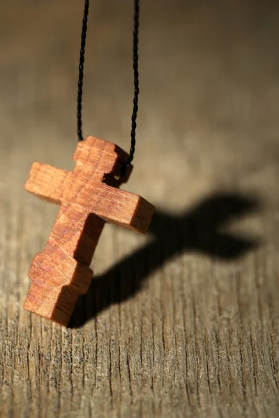 Wooden cross with deep shadow — Stock Photo, Image