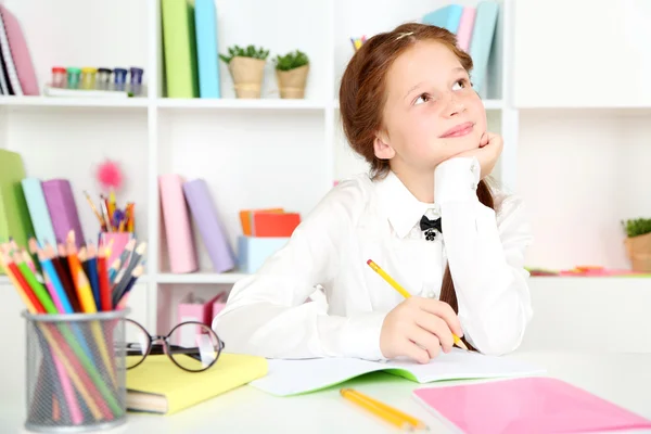 Cute girl in classroom — Stock Photo, Image