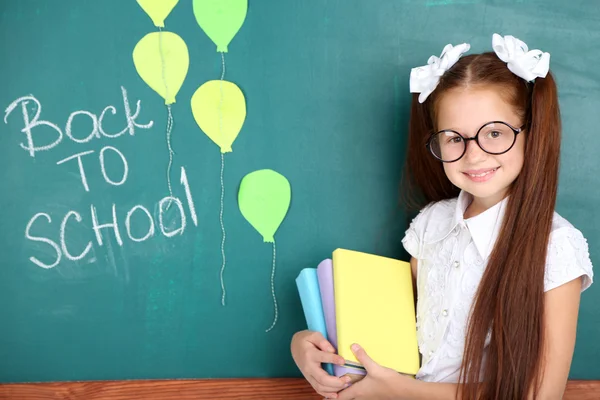 Cute girl in classroom — Stock Photo, Image